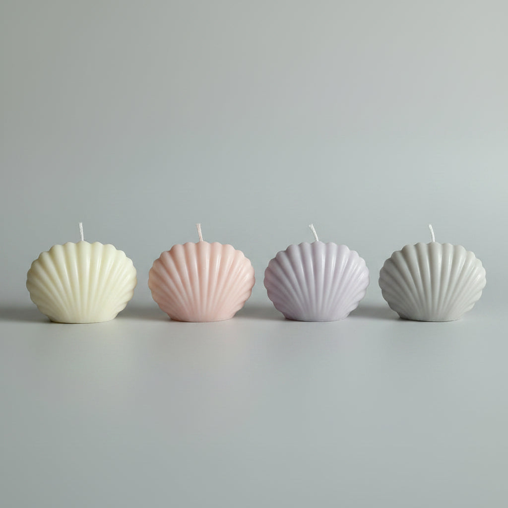 Bougie parfumée artisanale forme coquillage rose, gris et mauve
