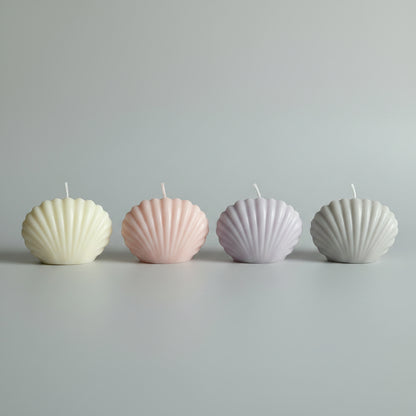 Bougie parfumée artisanale forme coquillage rose, gris et mauve
